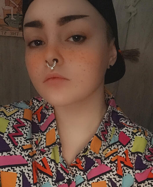 Selfie, 80s shape patterned shirt, black cap